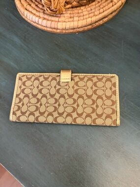 Coach Slim Wallet in Signature canvas with neutral tan monogram design